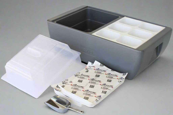 Metallic gray chafer with open top, clear lid inserts, and packaged serving accessories