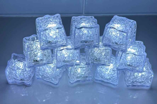 LED light-up ice cubes, clear cubes glowing blue, 12-pack set