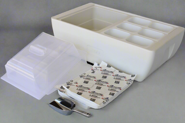 Polar white heated chafer with open lid, divided wells, and included utensils