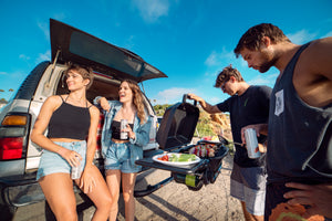 Friend Group grilling near beach