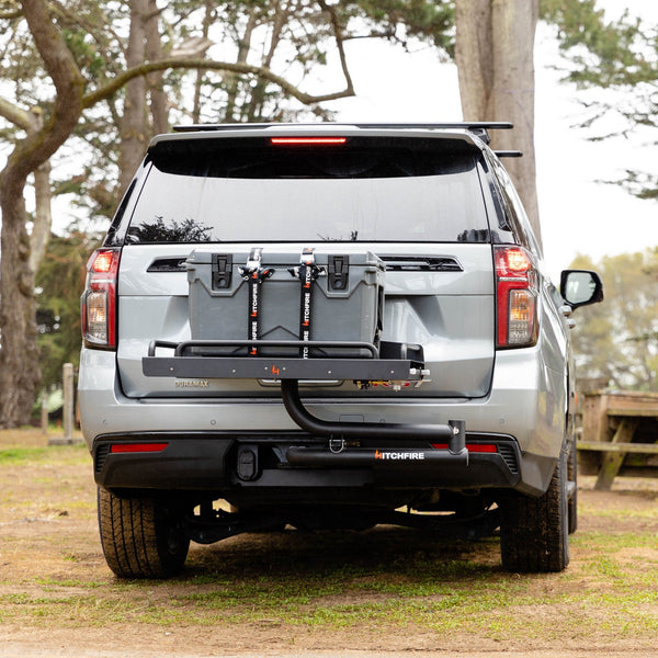 Vehicle rear cook station with swing platform closed and mounting bar