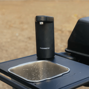 Dometic Go countertop faucet with black cylinder body and short spout