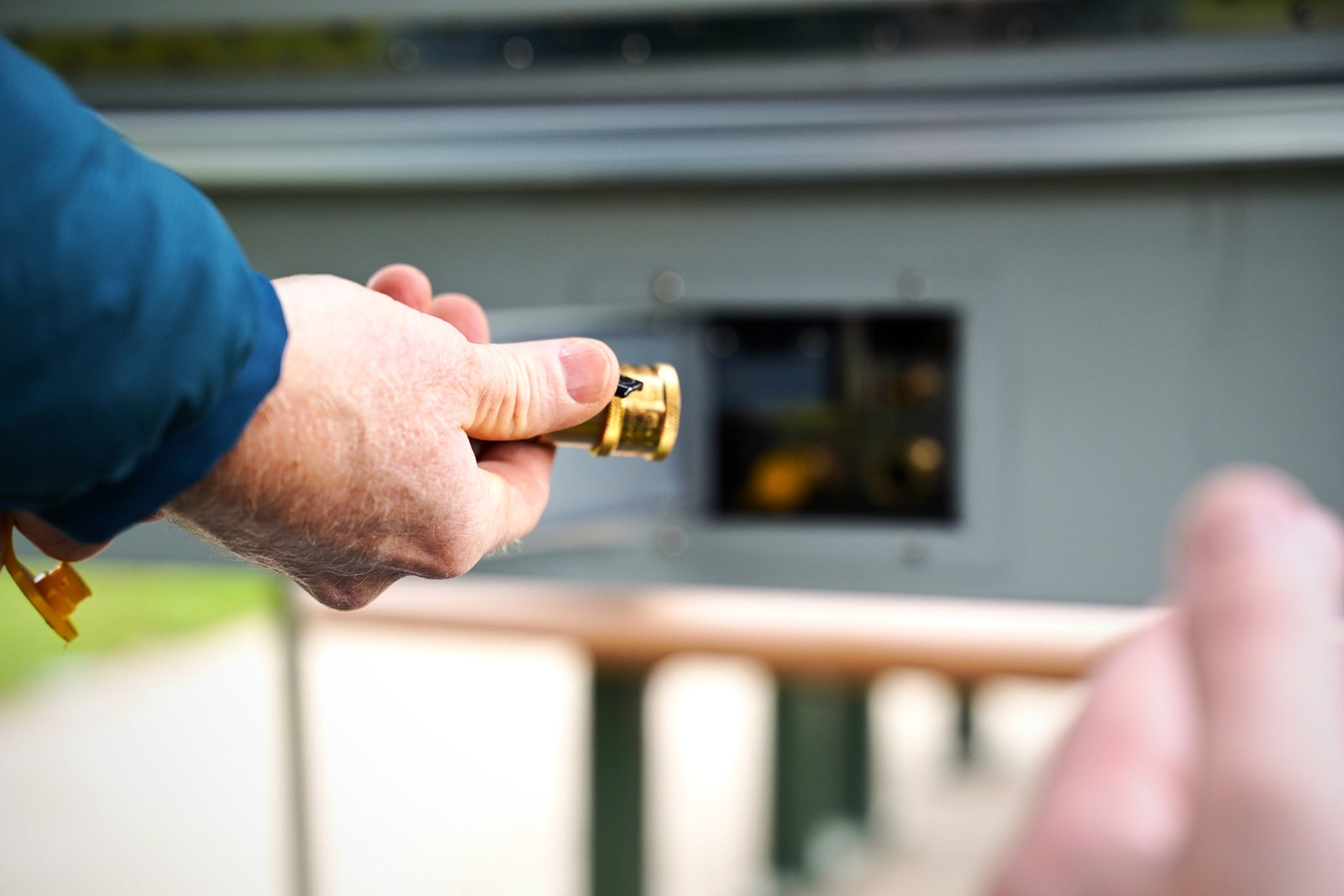 Hand connecting a brass quick-connect fitting
