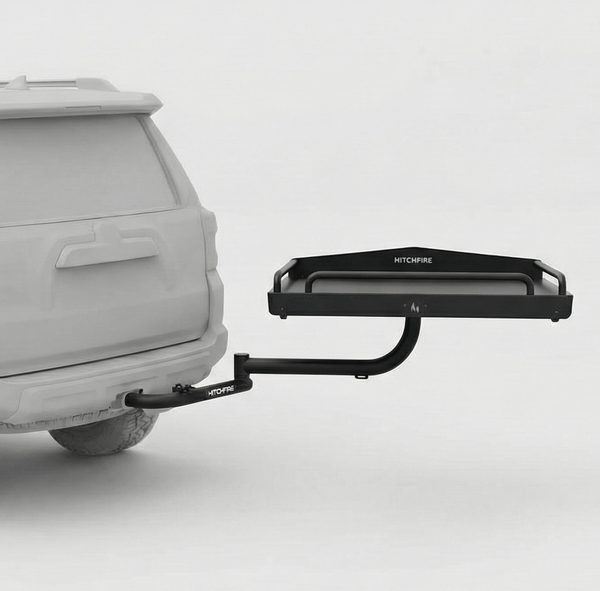 Hitch cargo platform with black platform tray and curved support arm installed on truck
