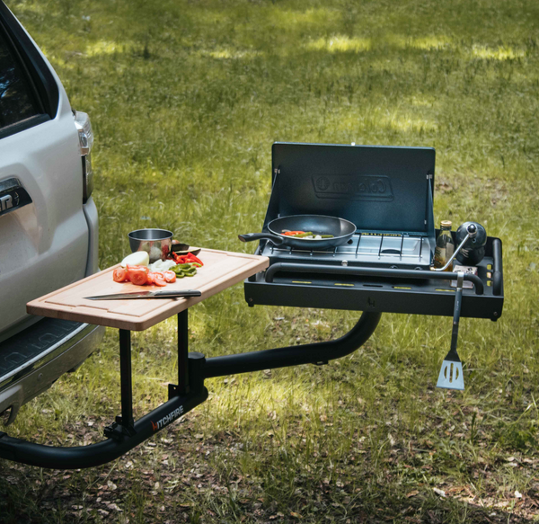 Ledge platform with Coleman stove and side table cutting board