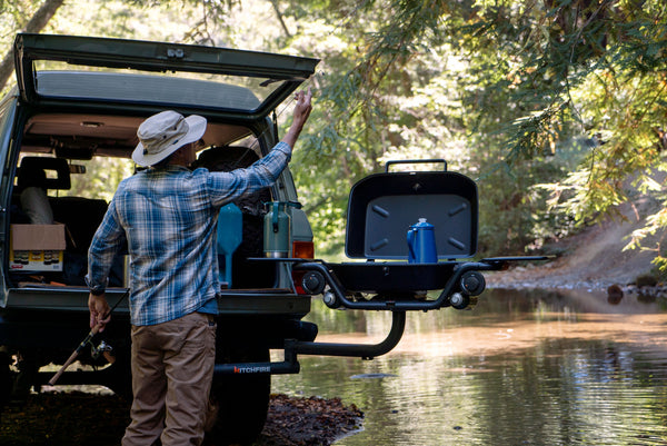 Fisherman with swing arm and grill opening