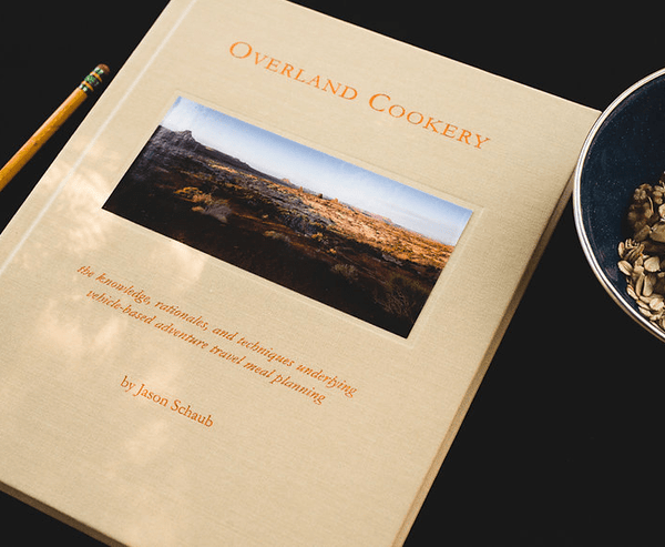 Overland Cookery cookbook cover in tan with title text and landscape inset