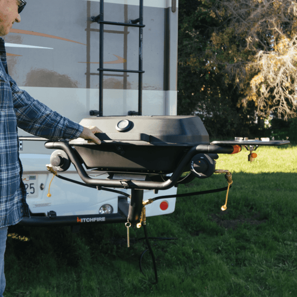 Quick connect hose connections on front of RV grill