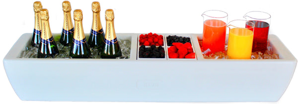 Polar white barge party cooler with champagne bottles and assorted drinks on top