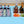 Load image into Gallery viewer, Light blue party cooler with divider holding bottles, ice, orange and cucumber slices
