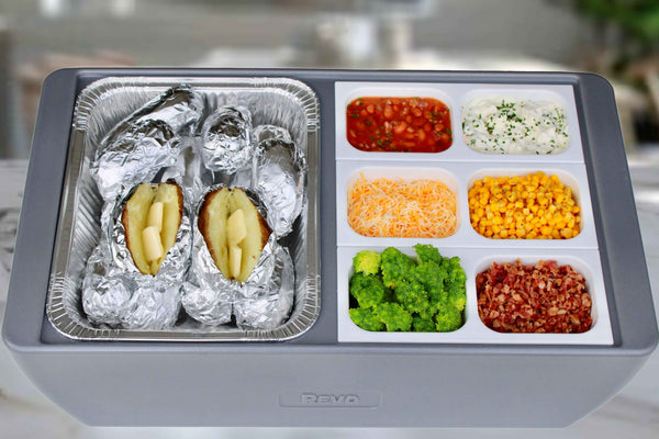Metallic gray flameless chafer with four food compartments and foil-lined serving trays