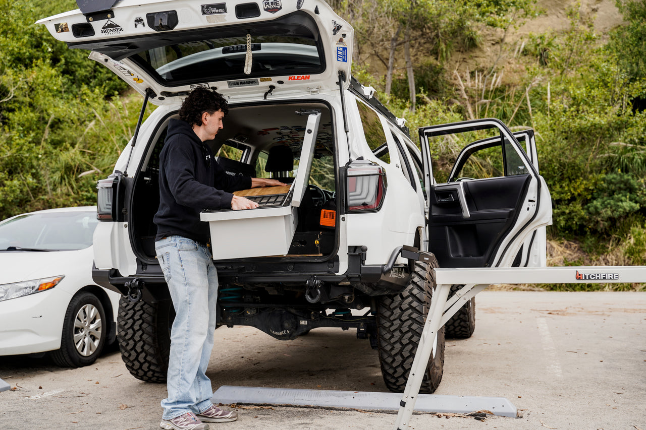 Camp Kitchen box on open rear hatch of off-road vehicle