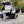 Load image into Gallery viewer, Camp Kitchen box open on vehicle rear with folding side table extended

