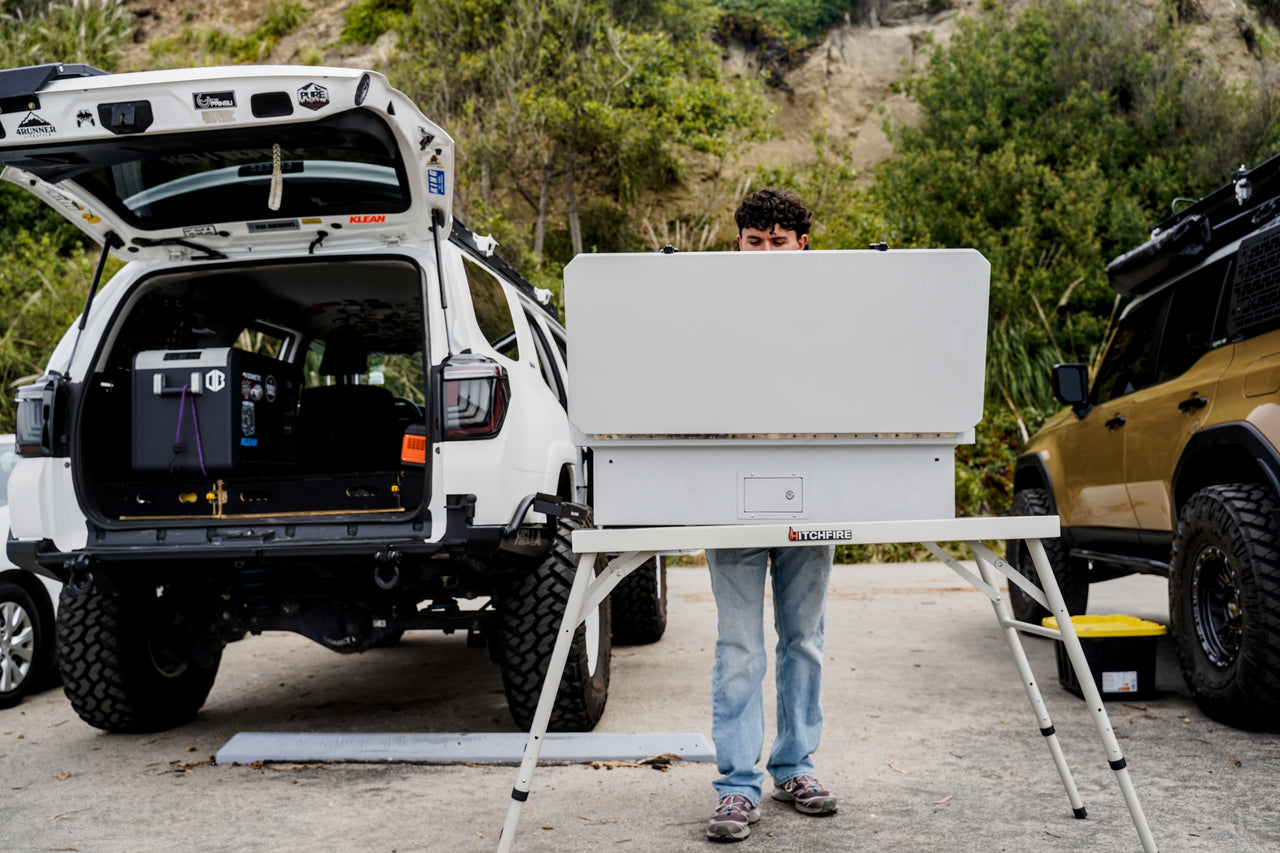 Camp Kitchen open on vehicle rear with folding stand and prep surface