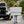 Load image into Gallery viewer, Camp Kitchen open on vehicle rear with folding stand and prep surface
