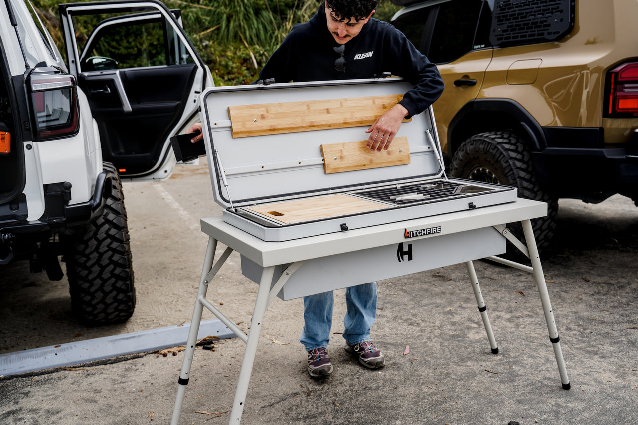 Camp Kitchen outdoor grill with cutting boards on open prep area