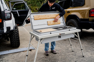 Camp Kitchen outdoor grill with cutting boards on open prep area