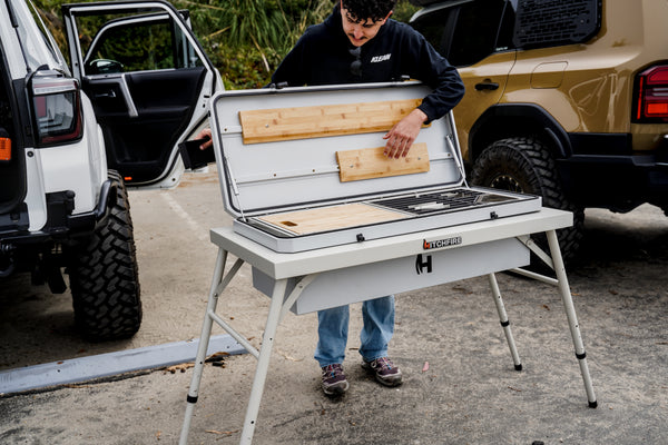 Camp Kitchen outdoor grill with cutting boards on open prep area