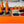 Load image into Gallery viewer, Orange party cooler with bottle holders, ice, and fruit tray for drinks
