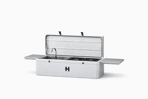 Camp kitchen grill with open lid showing sink and cooktop grates