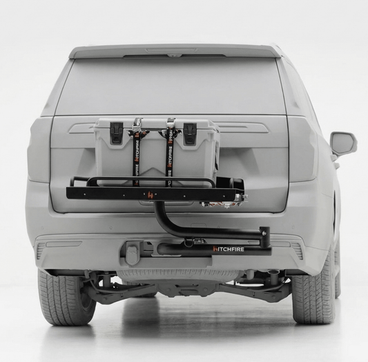 Cook station with folded swing arms under rear hatch, black