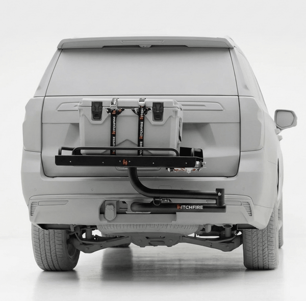 Vehicle-mounted cook station with grill and prep table, rear view on truck hitch