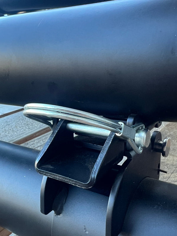 Installed latch pin with black bracket and silver locking clip