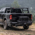 Truck with rear-mounted hitch cargo platform and mounted black gear box