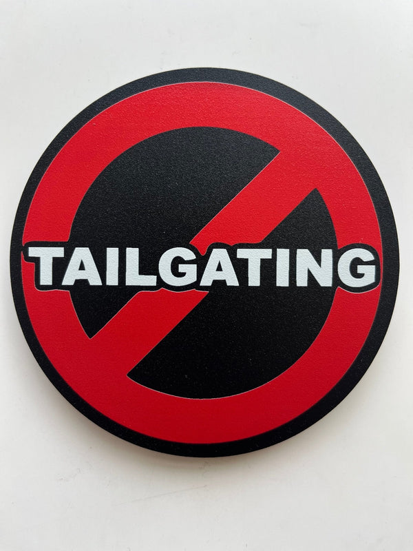 No tailgating hitch cover, circular red/black sign with TAILGATING and prohibition slash