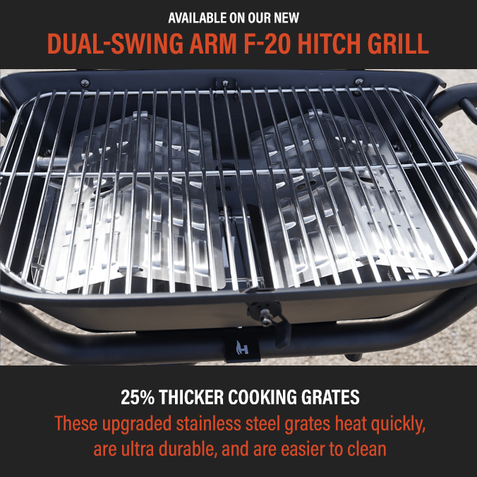 Hitch-mounted propane grill cooking grates with glossy black lid edge