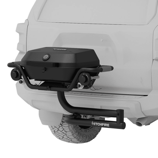 Hitch-mounted black propane grill with Hitchfire branding and swing-away frame
