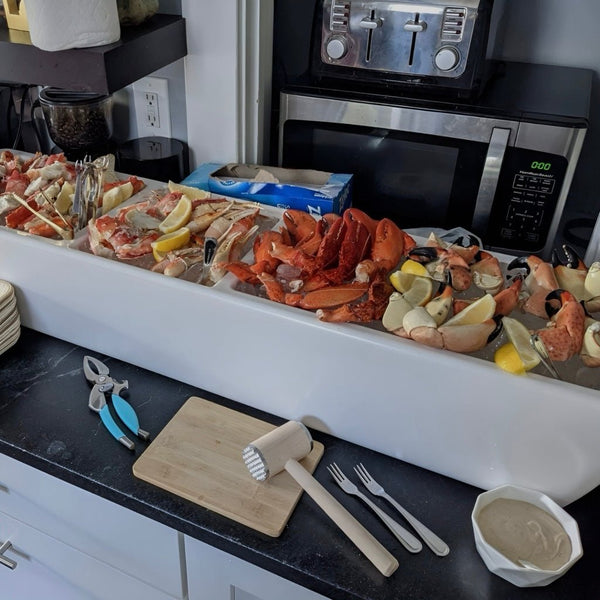 Greige mist party barge cooler holding seafood platter items with ice.