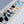 Load image into Gallery viewer, Greige mist party barge cooler with divided compartments, bottles, and ice.
