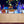 Load image into Gallery viewer, Greige mist party barge cooler with bottles on ice in the top channel.

