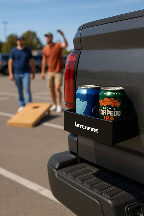 Black magnetic cupholder and spice rack on truck side, holding two cans on shelf