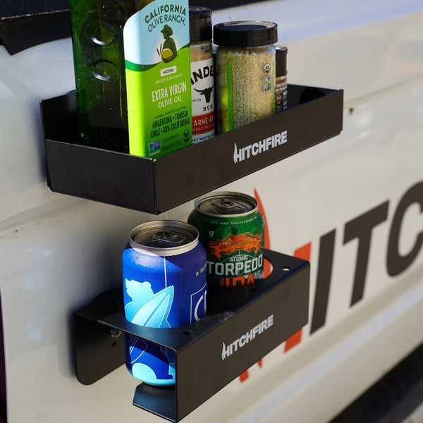 Magnetic spice rack with multiple bins holding green bottle and cans