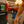 Load image into Gallery viewer, Magnetic spice rack and cupholder with drink cans on truck rear, hand reaching toward it
