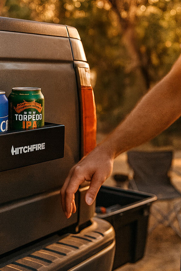 Black magnetic cupholder tray on truck tail with drink cans, outdoor side view
