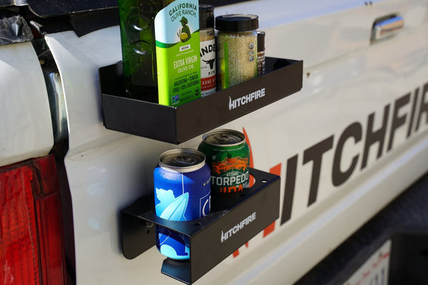 Magnetic spice rack and cupholder, black two-level holders with cans and bottles on truck