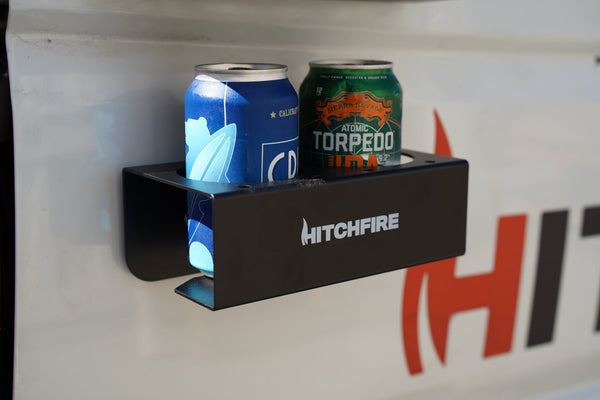 Magnetic spice rack and cupholder, black tray holding two drink cans and a side slot
