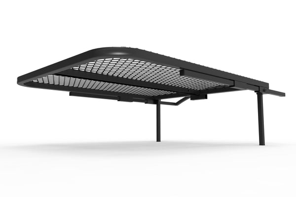 Black wire mesh camping table with side shelf and four straight legs, shown front angle.