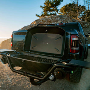 F-20 hitch-mounted propane grill with lid open, rear view of black grill