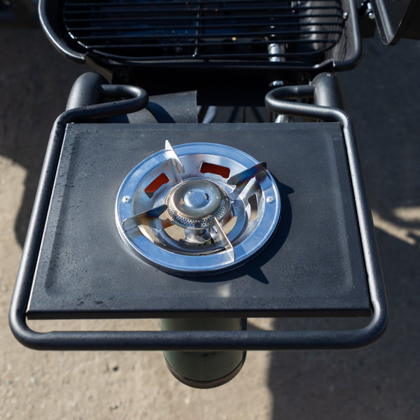 Side view of side burner table and open grill