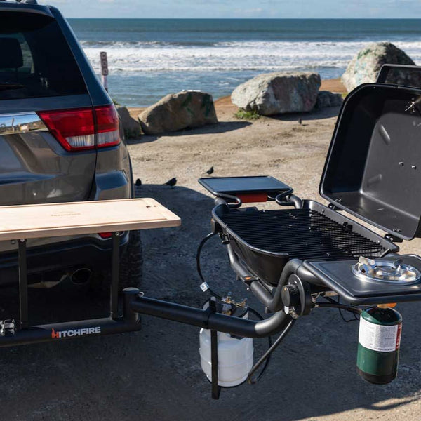 Open grill and side table near ocean