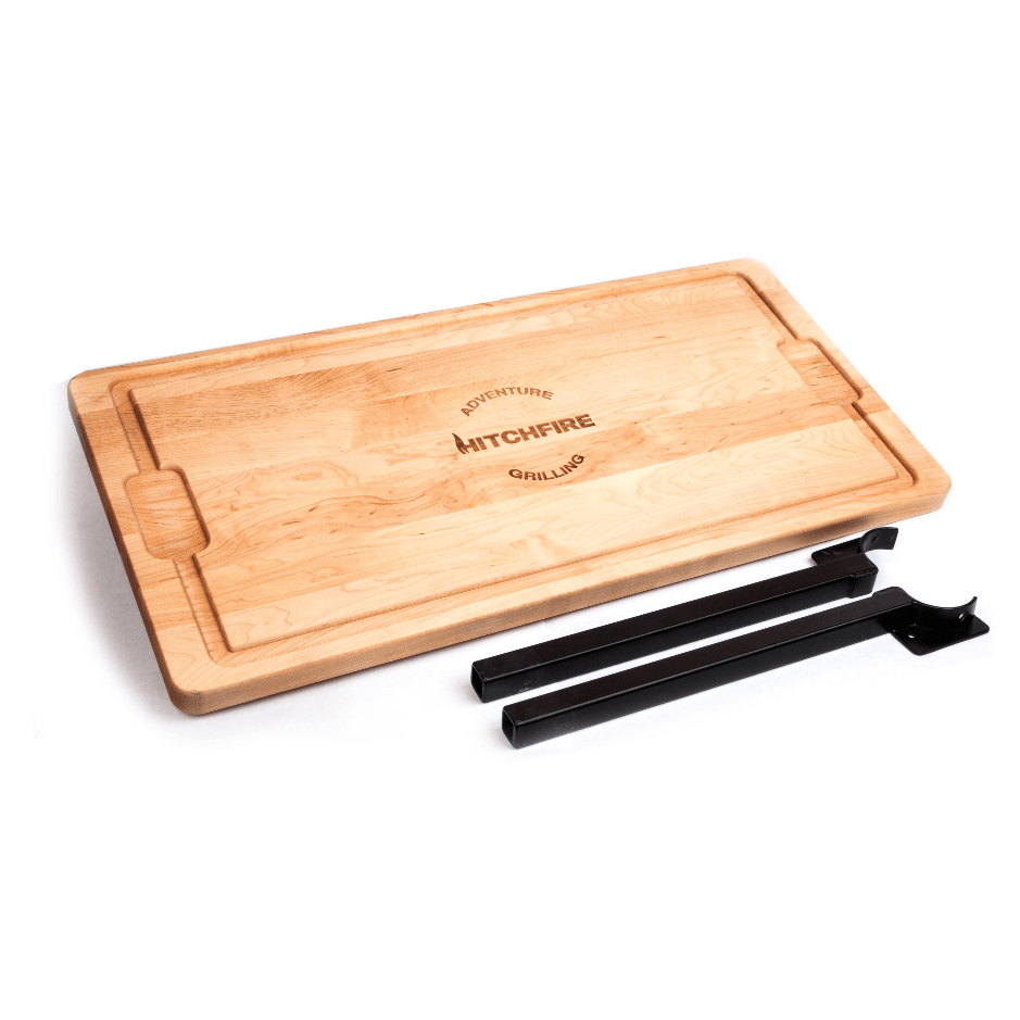 Cutting board side table with light wood top and HITCHFIRE logo