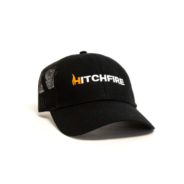 Black mesh-back baseball cap with orange HitchFire logo patch on front