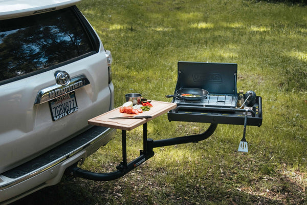 Outdoor vehicle ledge platform with fold-out side table and mounting rails