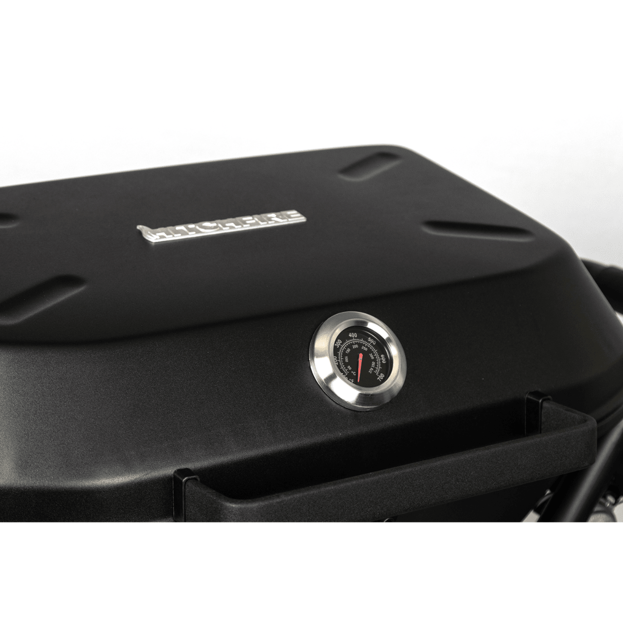 Black grill control panel with round temperature gauge on the lid